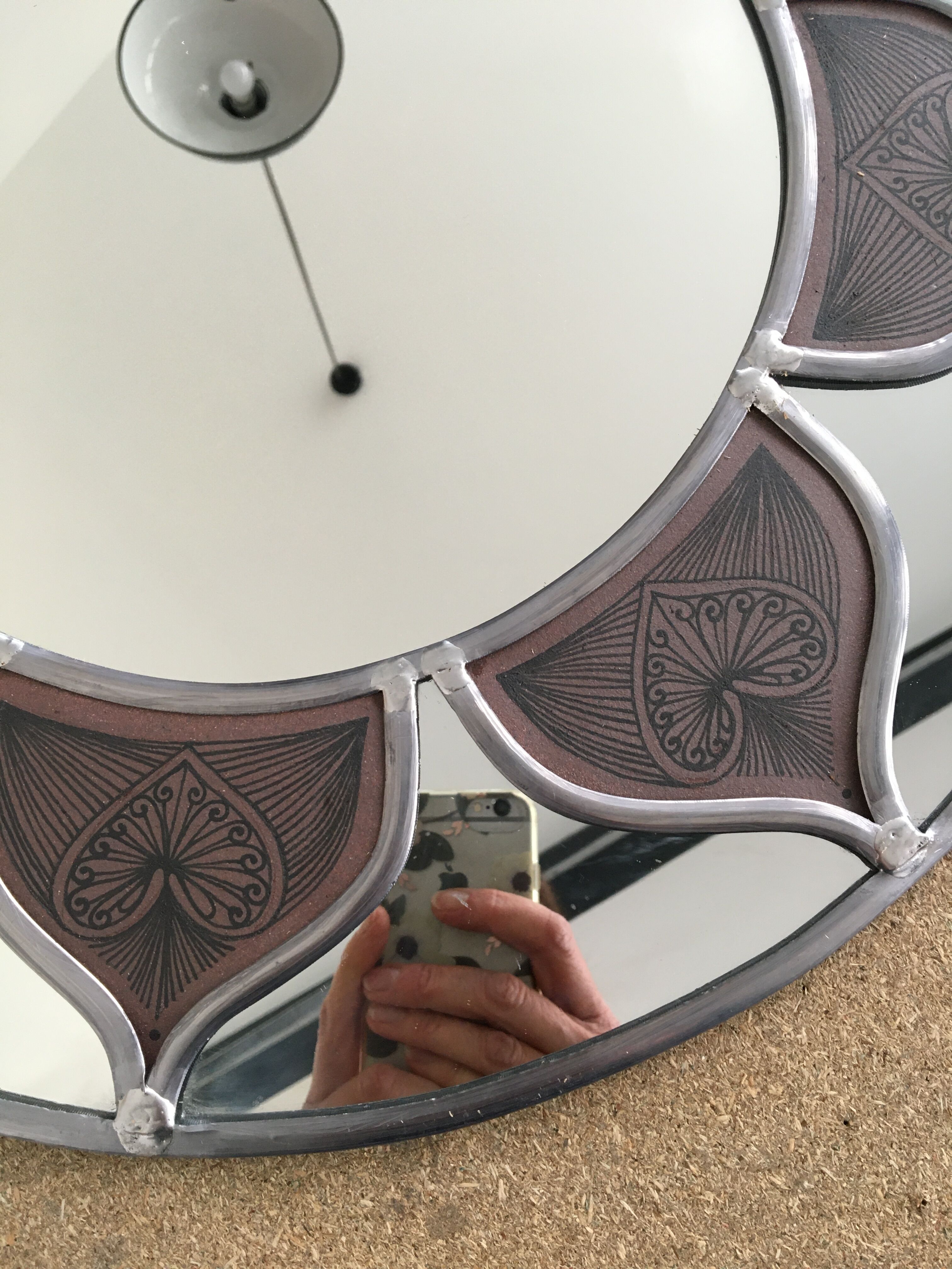 Mirror sun stained glass and ceramic inclusions