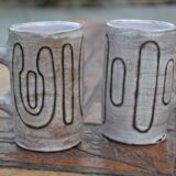 2 ceramic mugs signed db