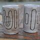 2 mugs en céramique signés db