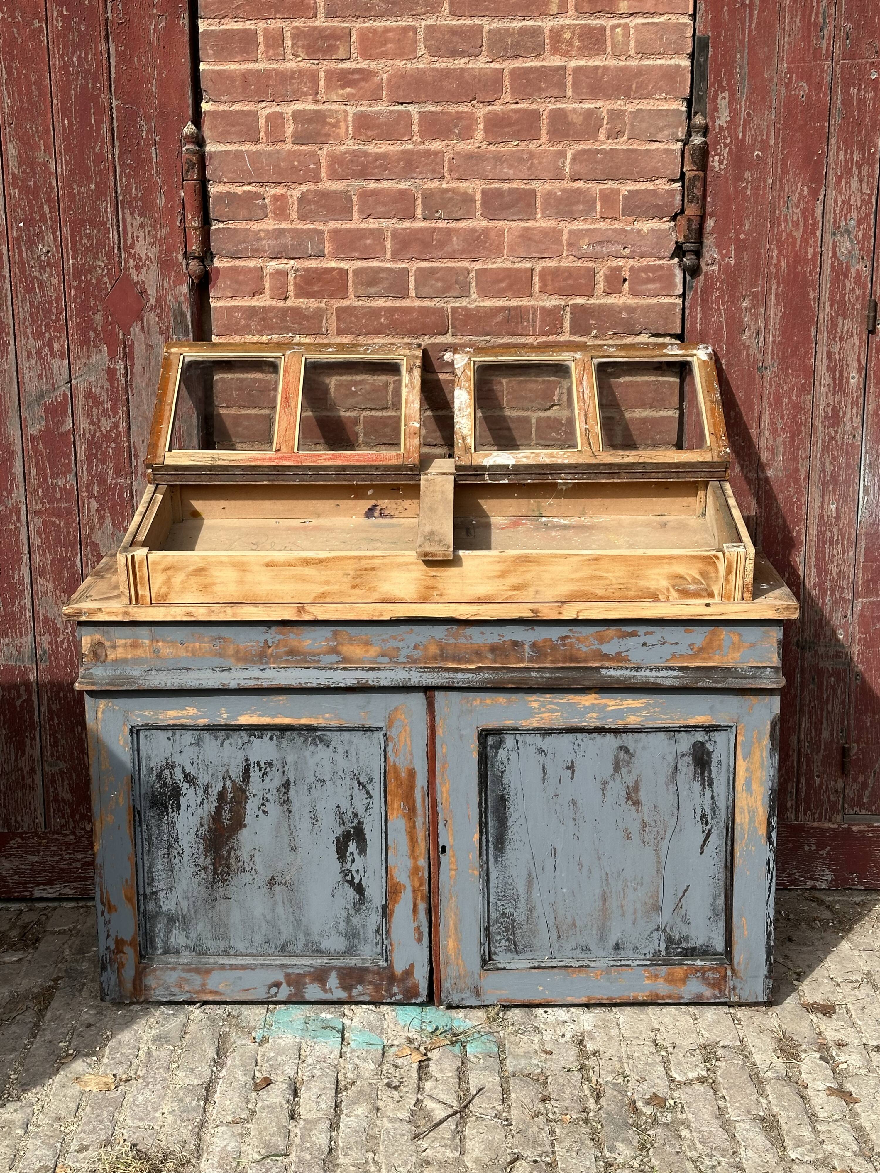 Showcase for boutique furniture, inclined boxes for presentation of collections on low sideboard