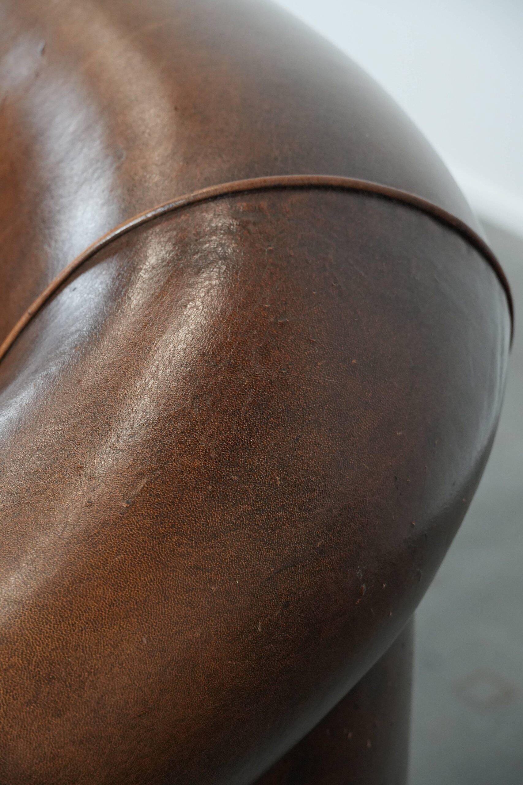 Characterful vintage sturdy 2-seater club sofa made of sheepskin leather