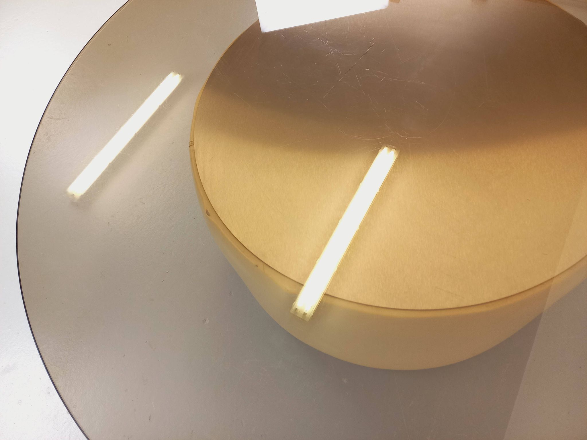 Vintage round coffee table in glass, leather, and metal in Space Age style from the 70s.