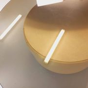 Vintage round coffee table in glass, leather, and metal in Space Age style from the 70s.