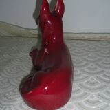 Saint Clement. Dog lying in earthenware