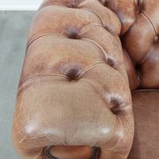Chesterfield armchair in English style made of cowhide leather