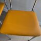 LM vintage chrome and orange/mustard yellow faux leather chairs