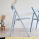 Blue folding chairs in lacquered wood