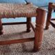 4 chairs and stools, brutalist art, straw and wood