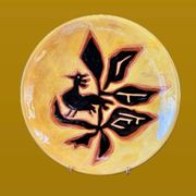 Terracotta plate, Jean Lurçat decorated with a rooster and foliage.