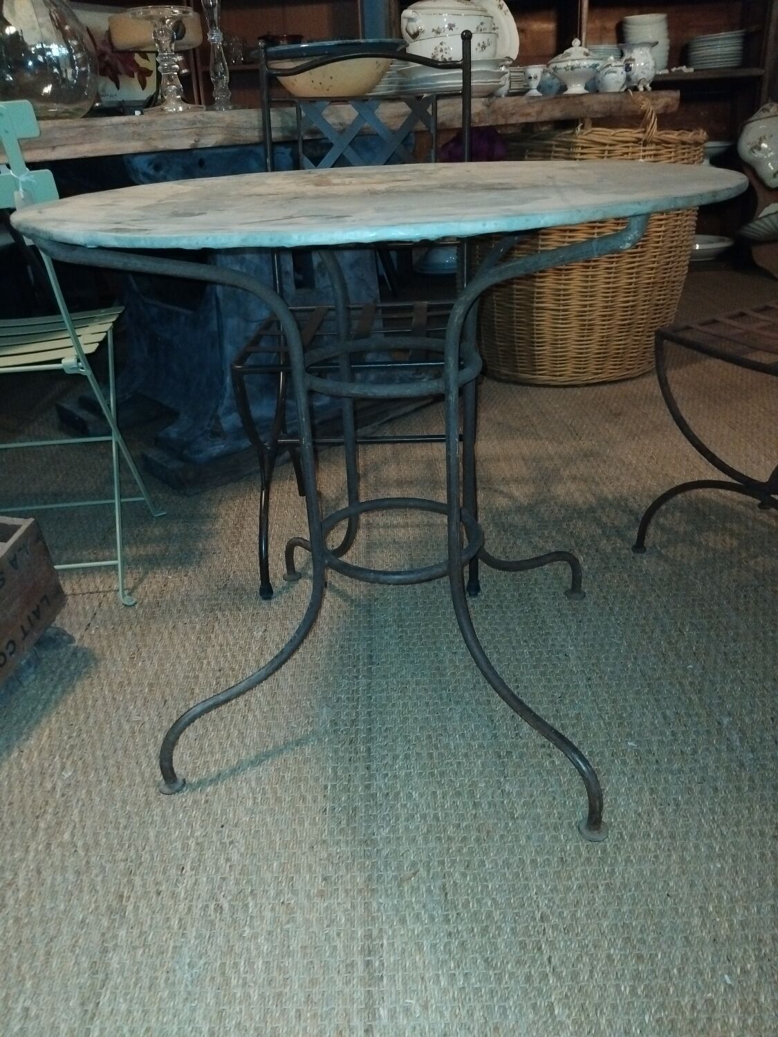 Wrought iron and zinc garden table