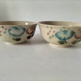 Two large vintage bowls in pastel decor on mini pedestals.