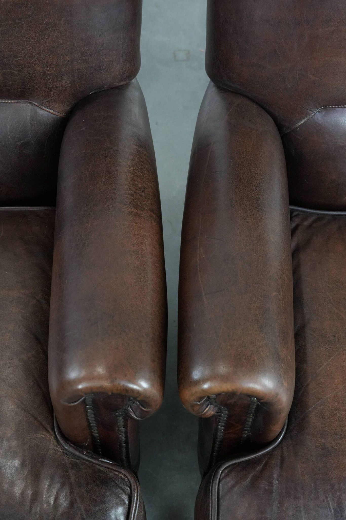 Set of two characterful sheepskin armchairs with a beautiful deep colour