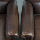 Set of two characterful sheepskin armchairs with a beautiful deep colour