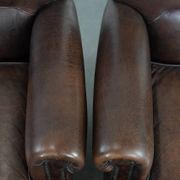 Set of two characterful sheepskin armchairs with a beautiful deep colour