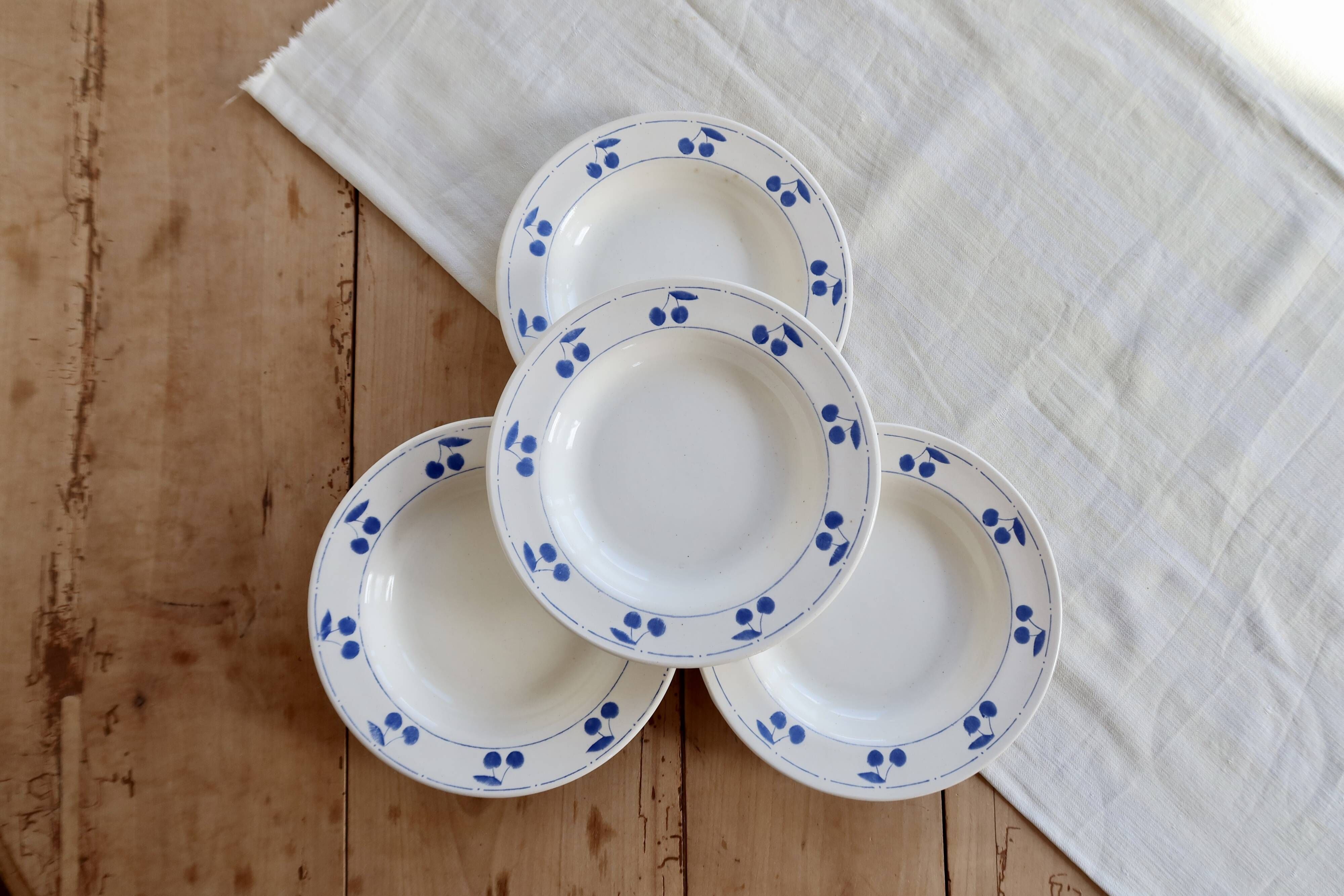 4 vintage deep plates in ivory earthenware with blue cherries