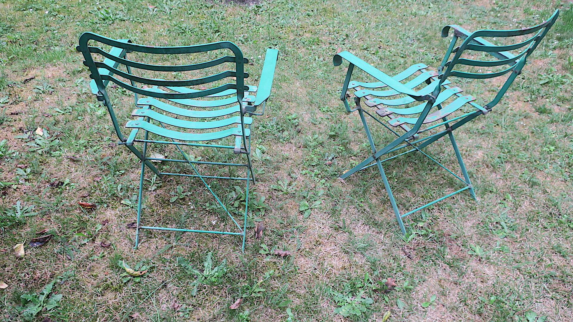 Pair of mid century distressed painted iron garden chairs