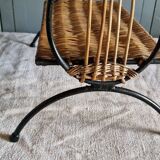 Small antique piece of furniture from the 1960s made of rattan and wrought iron in the shape of a lyre.