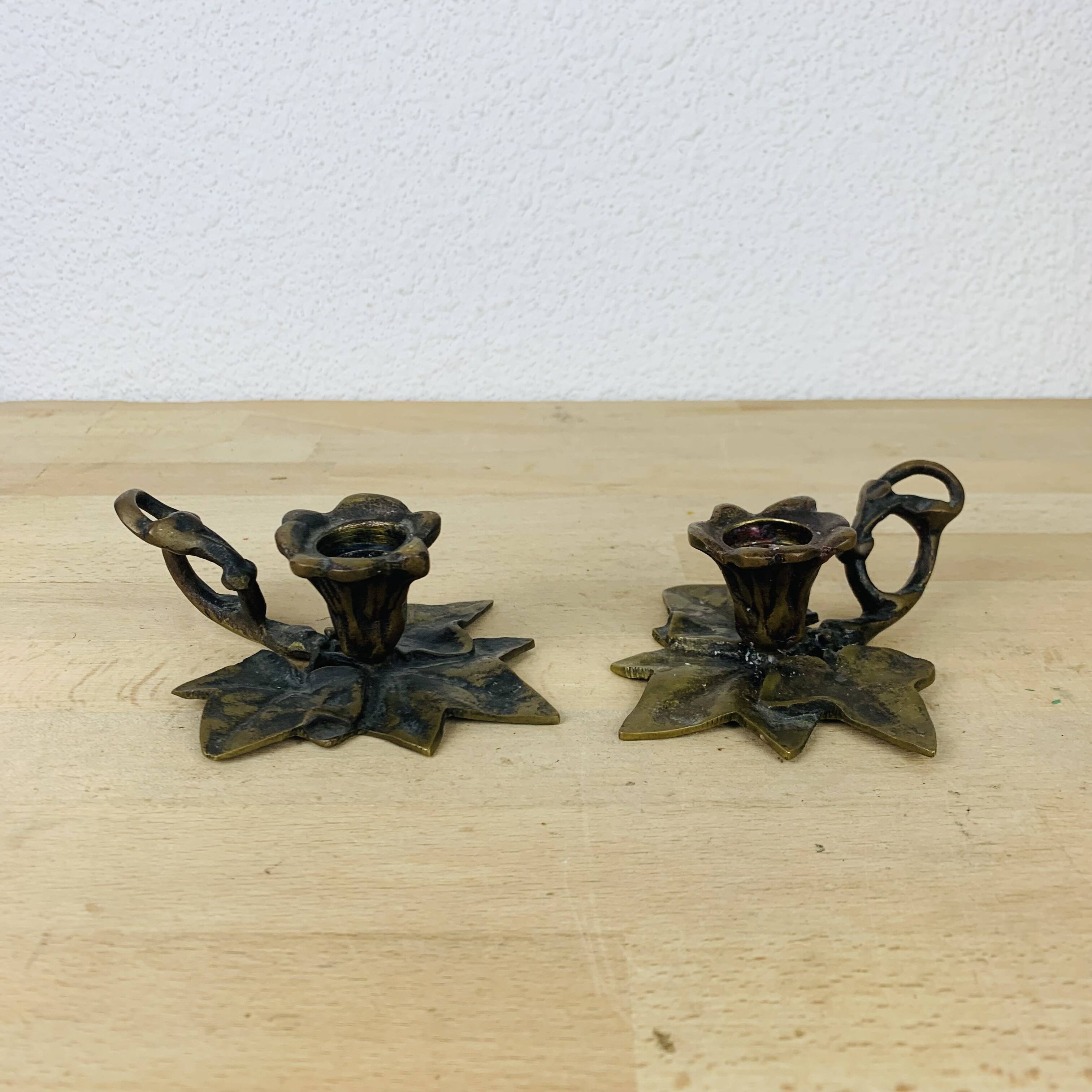 Pair of brass flower candlesticks, cellar