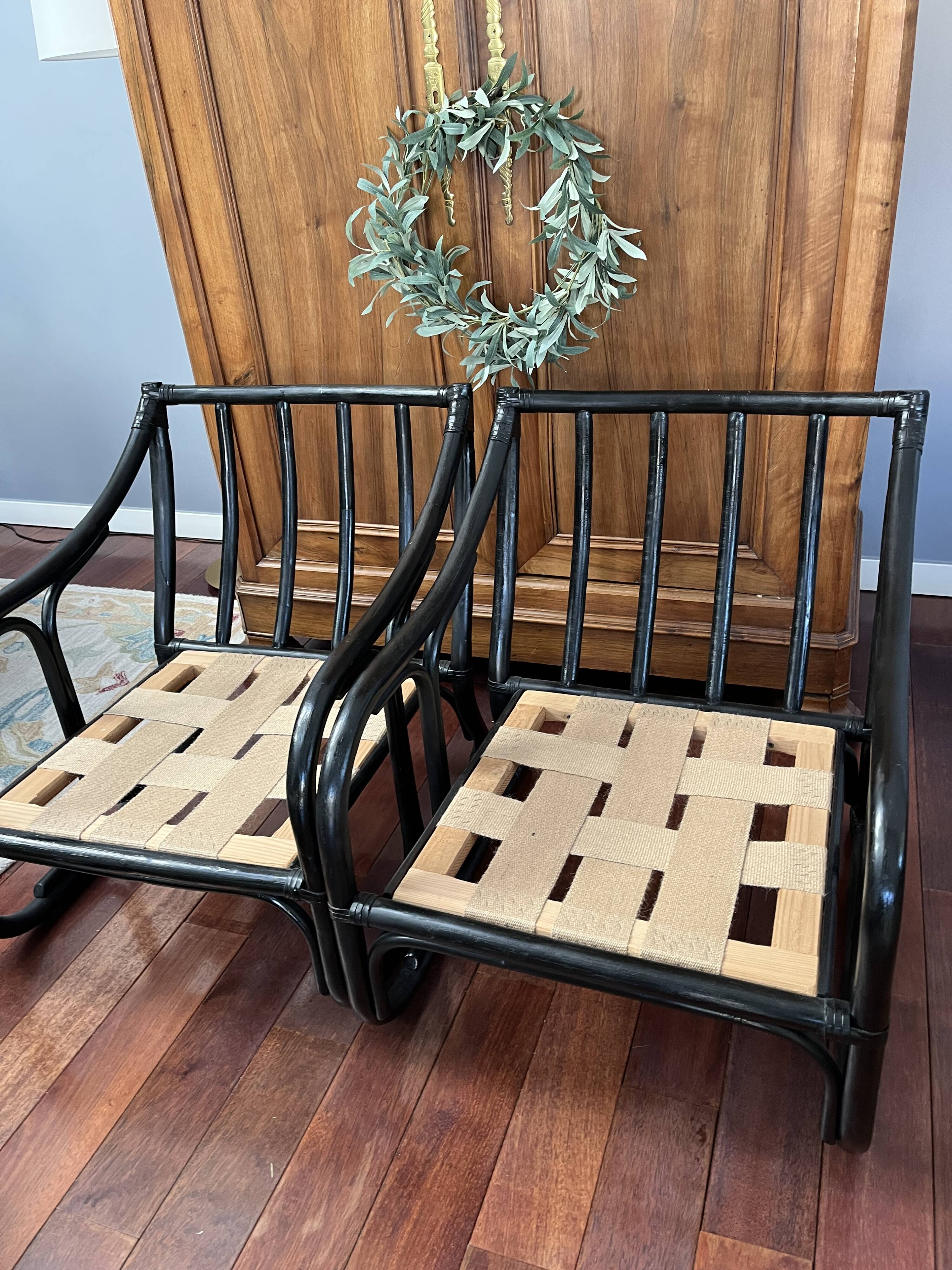 Set of two vintage black and white bamboo chairs.