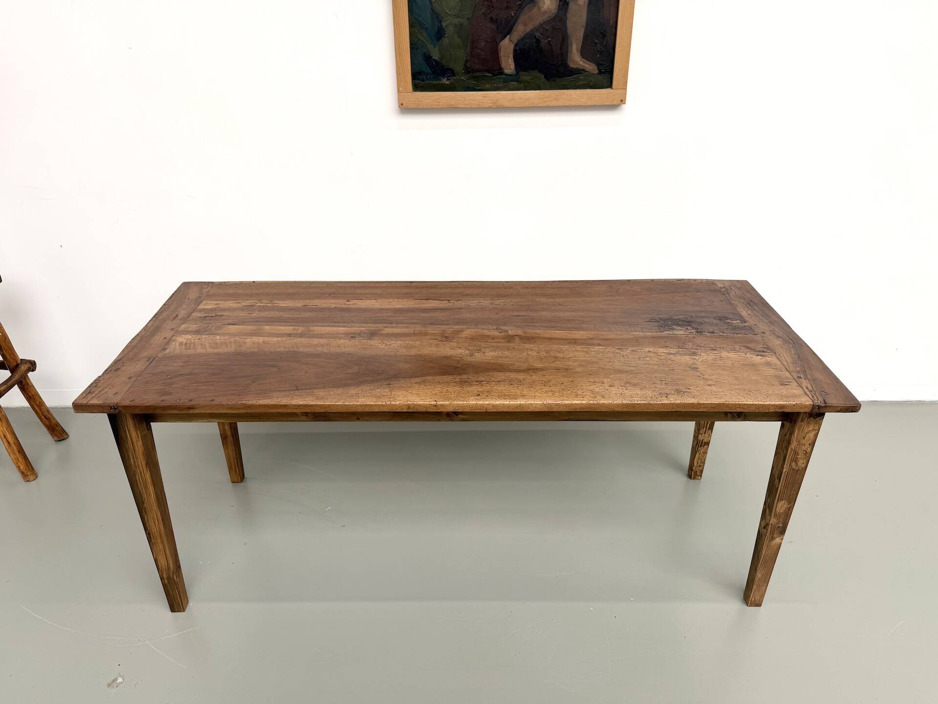 Farm table in walnut with spindle legs.