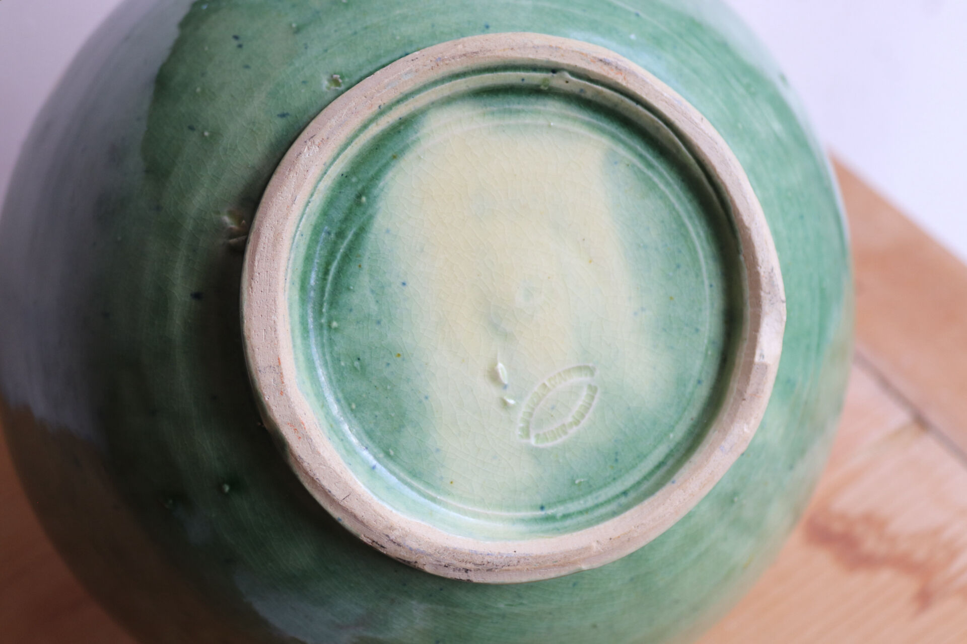 Large glazed ceramic salad bowl with a floral design.