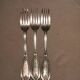 3 silver metal forks