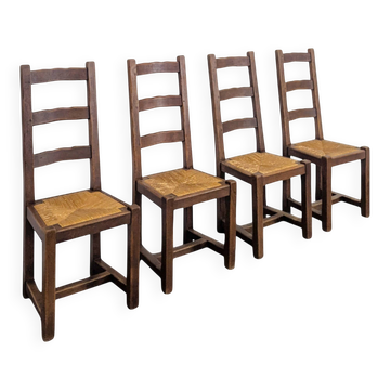 Set of 4 rustic oak chairs with straw seats.