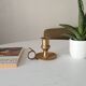 Antique hand candlestick in solid gilded brass.