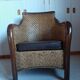 Fauteuil rotin tressé et bois exotique