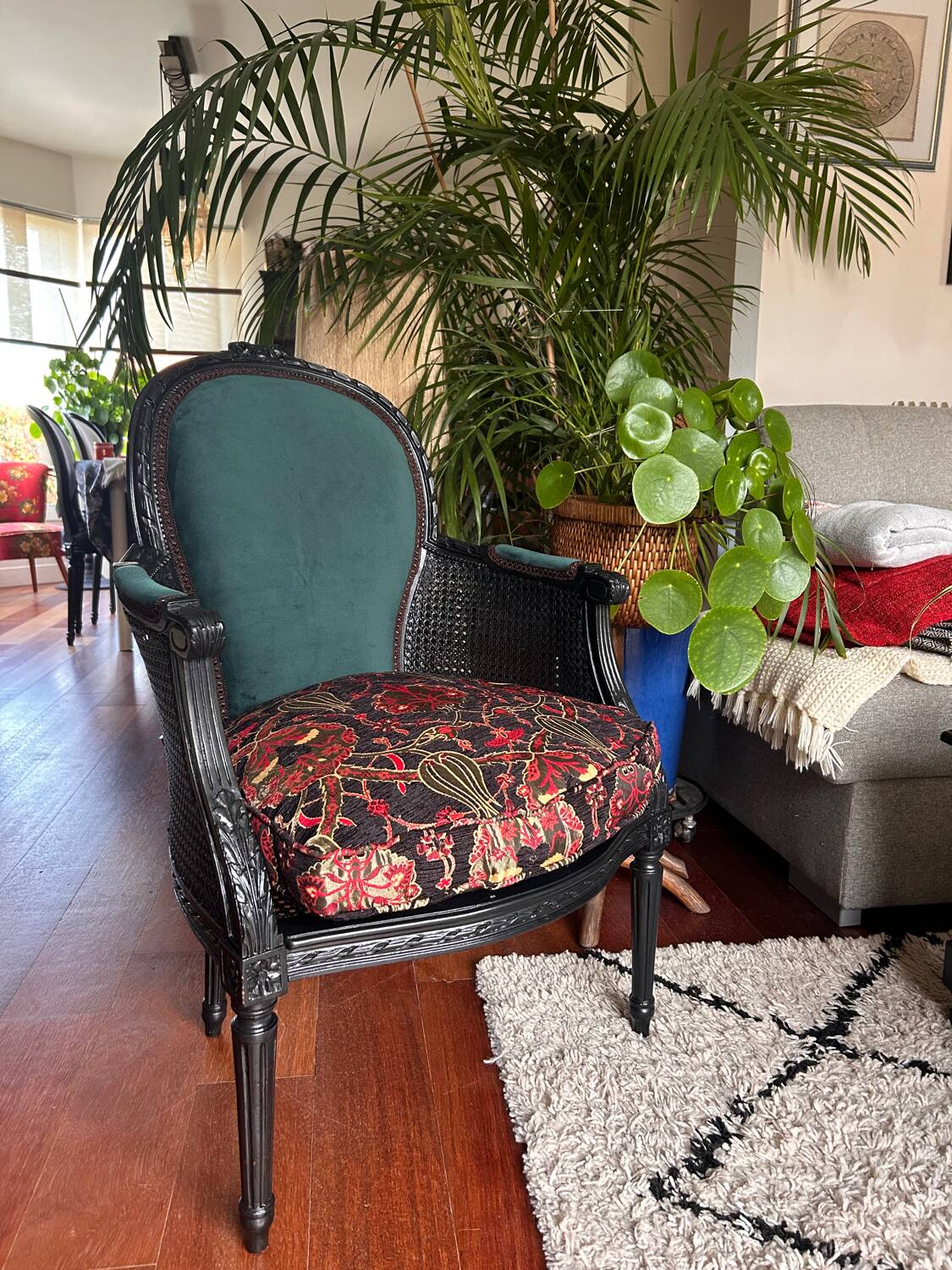 Louis XVI armchair with caning and dark green velvet