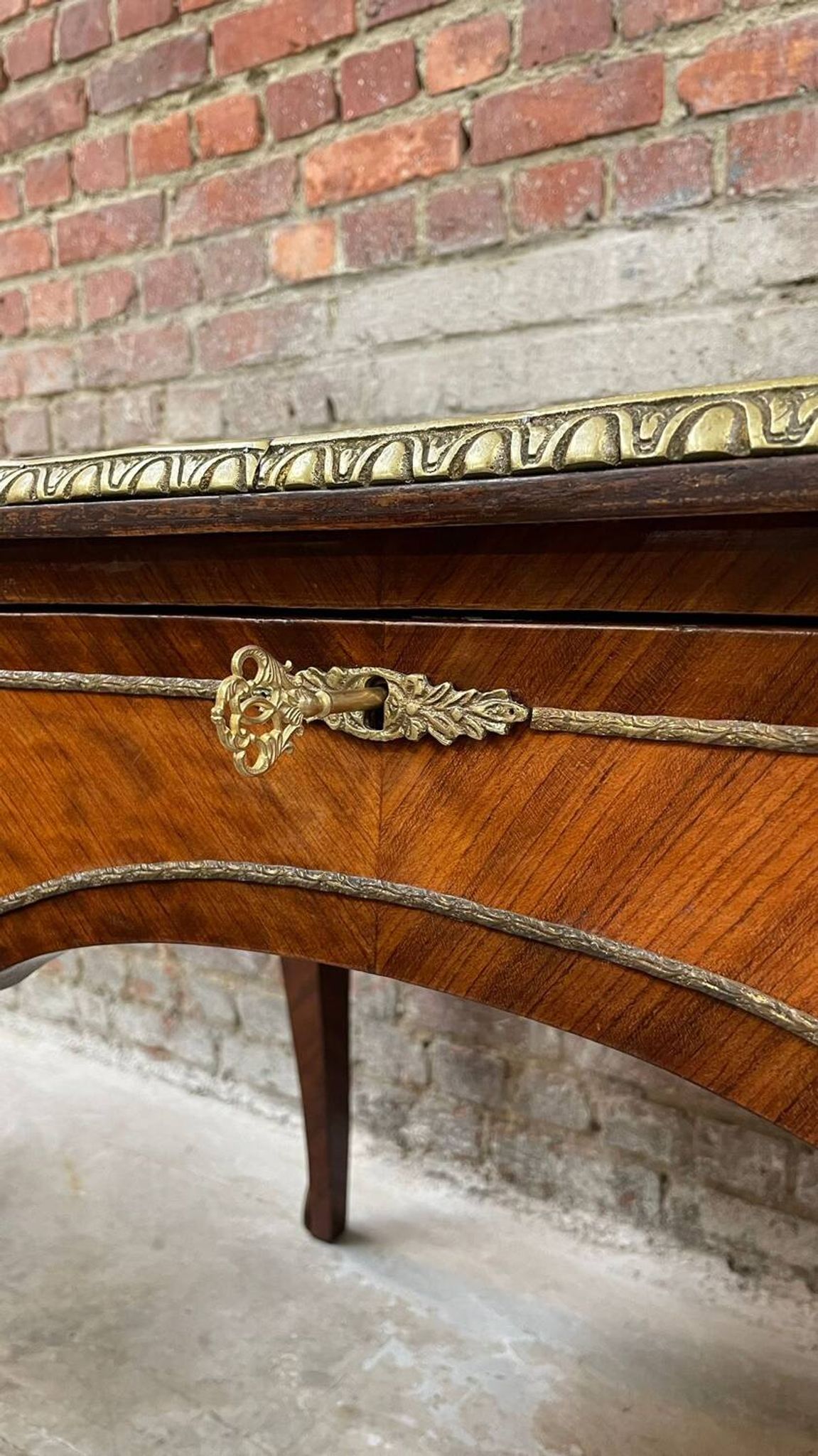 Antique French-style desk with green leather top and bronze mounts