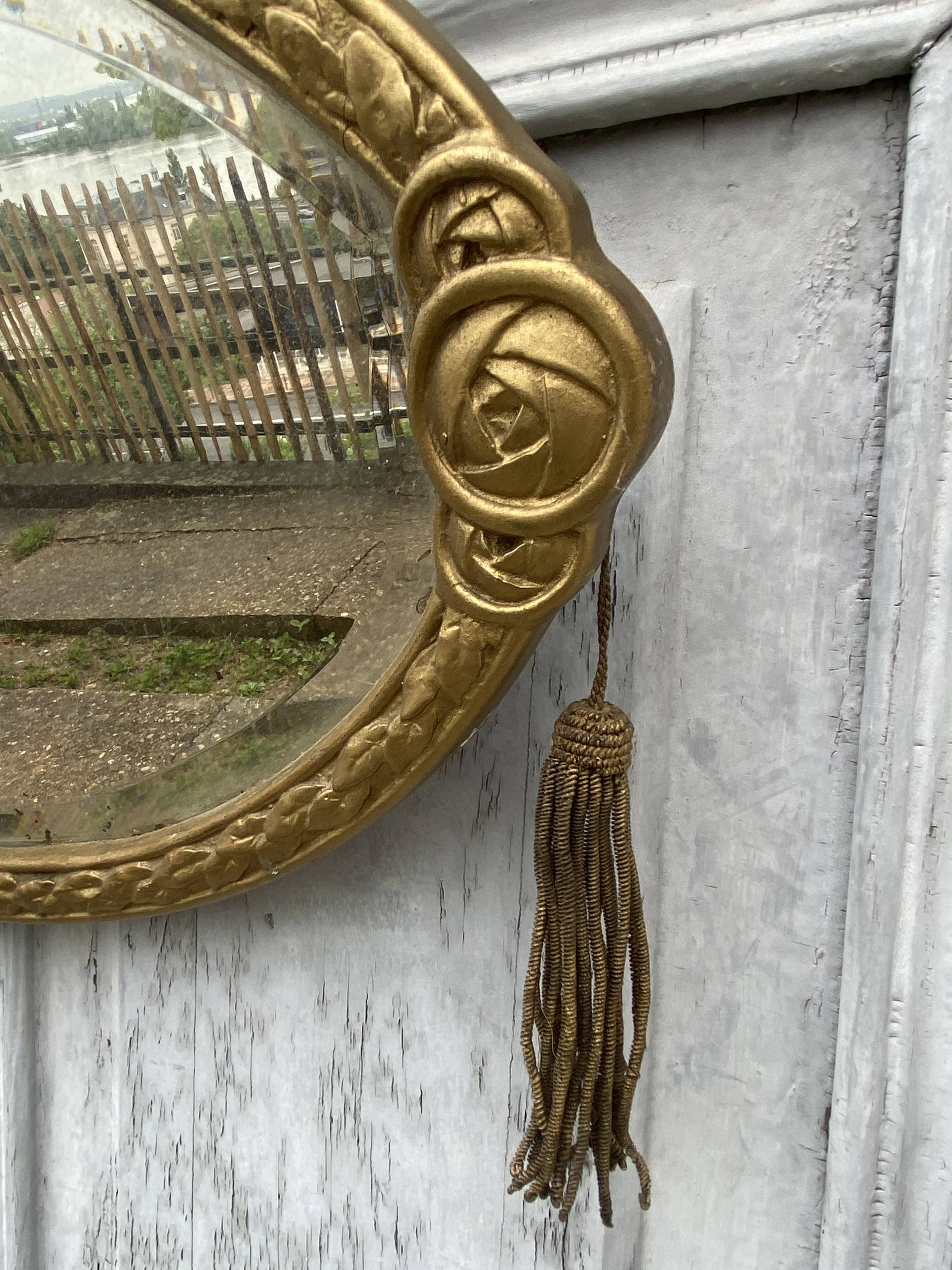 Miroir ovale art déco avec pompons