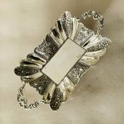 St Louis XV style letter tray, empty pocket, 20th century, in repoussé metal.
