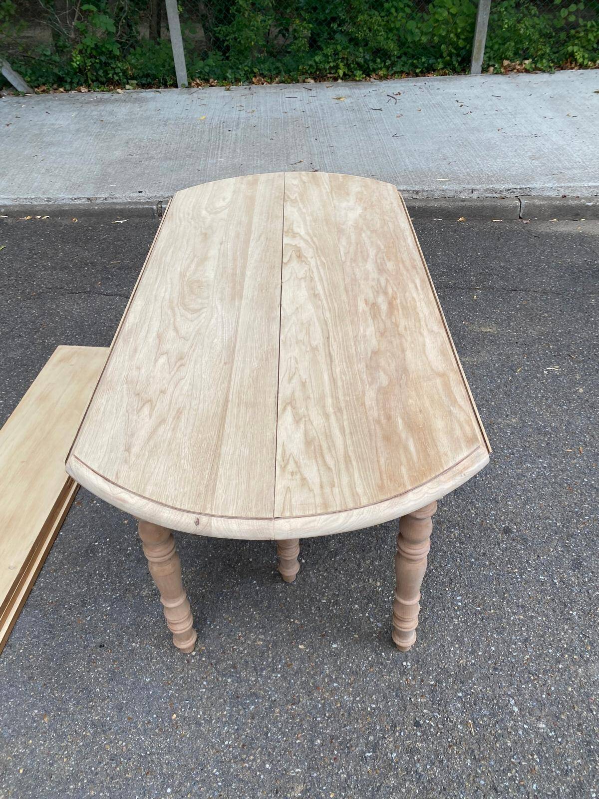 Renovated Louis Philippe round extendable dining table with flaps and 3 extensions.
