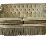 Vintage green two-seater sofa with fringes