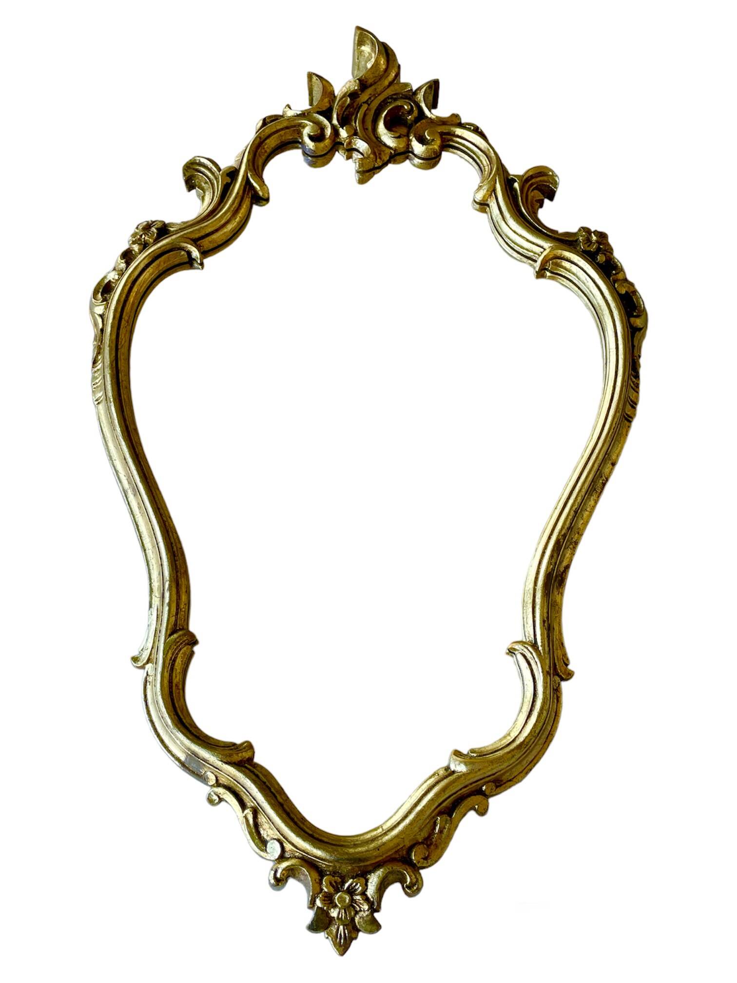 Old baroque style wall mirror with golden moldings