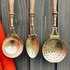 Brass holder with 3 brass & wood utensils
