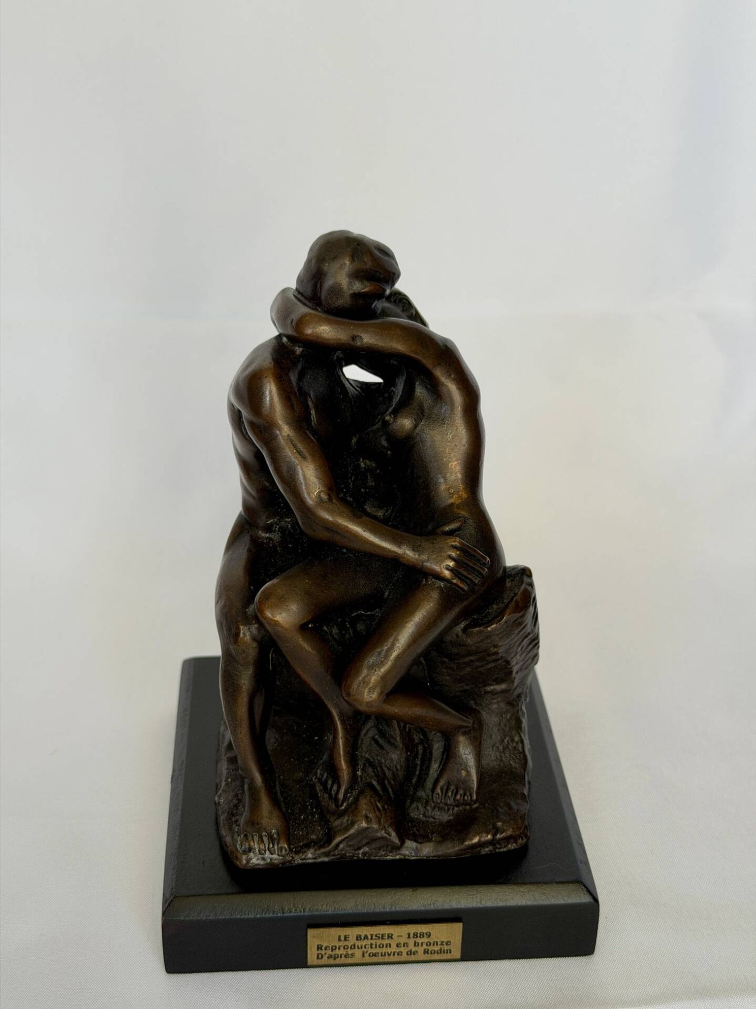 The bronze sculpture The Kiss, a reproduction of Rodin's statue, French sculpture.
