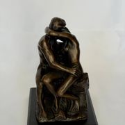 The bronze sculpture The Kiss, a reproduction of Rodin's statue, French sculpture.