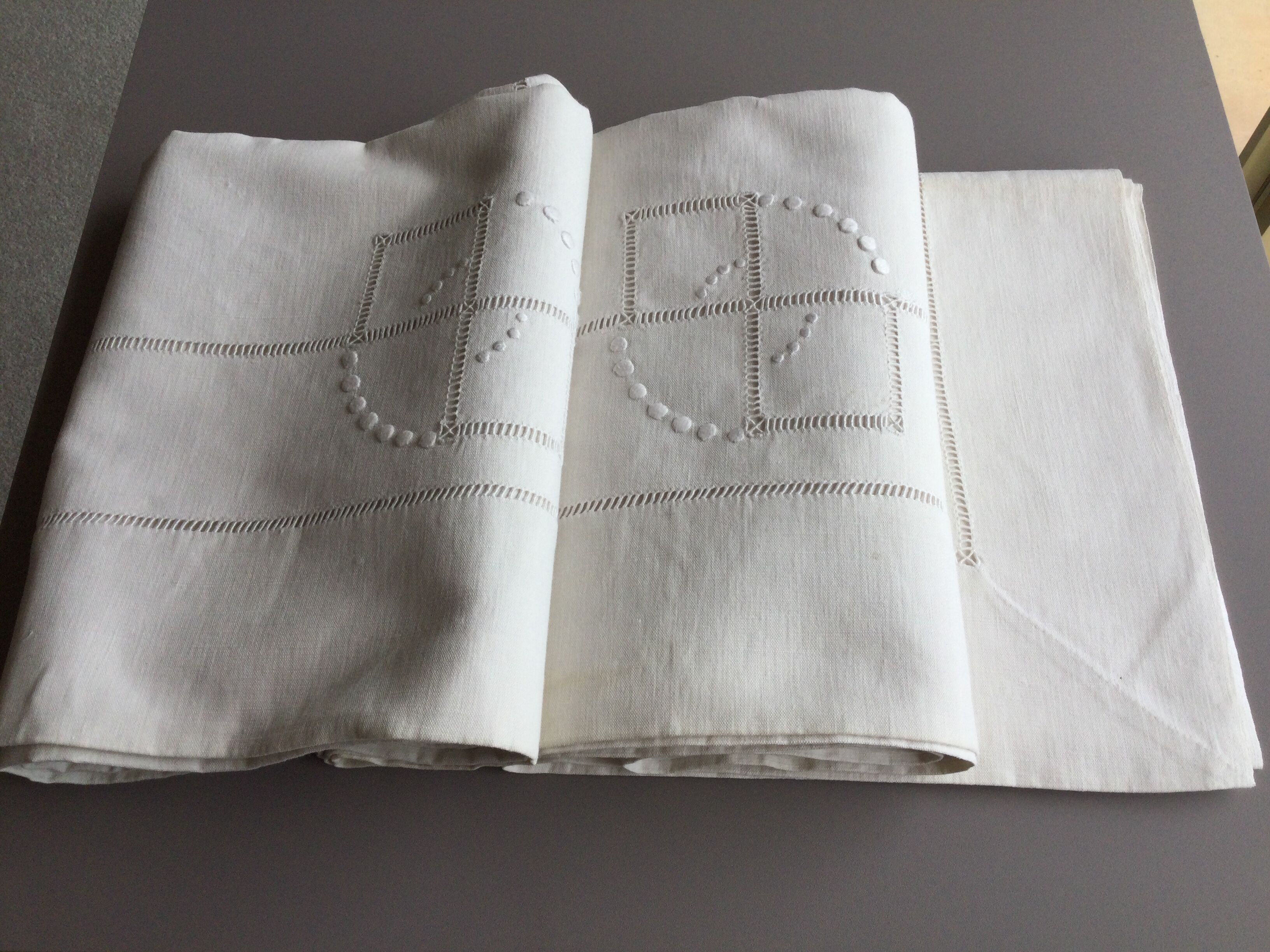 Old linen sheet embroidered with ecru-beige colors with monogram