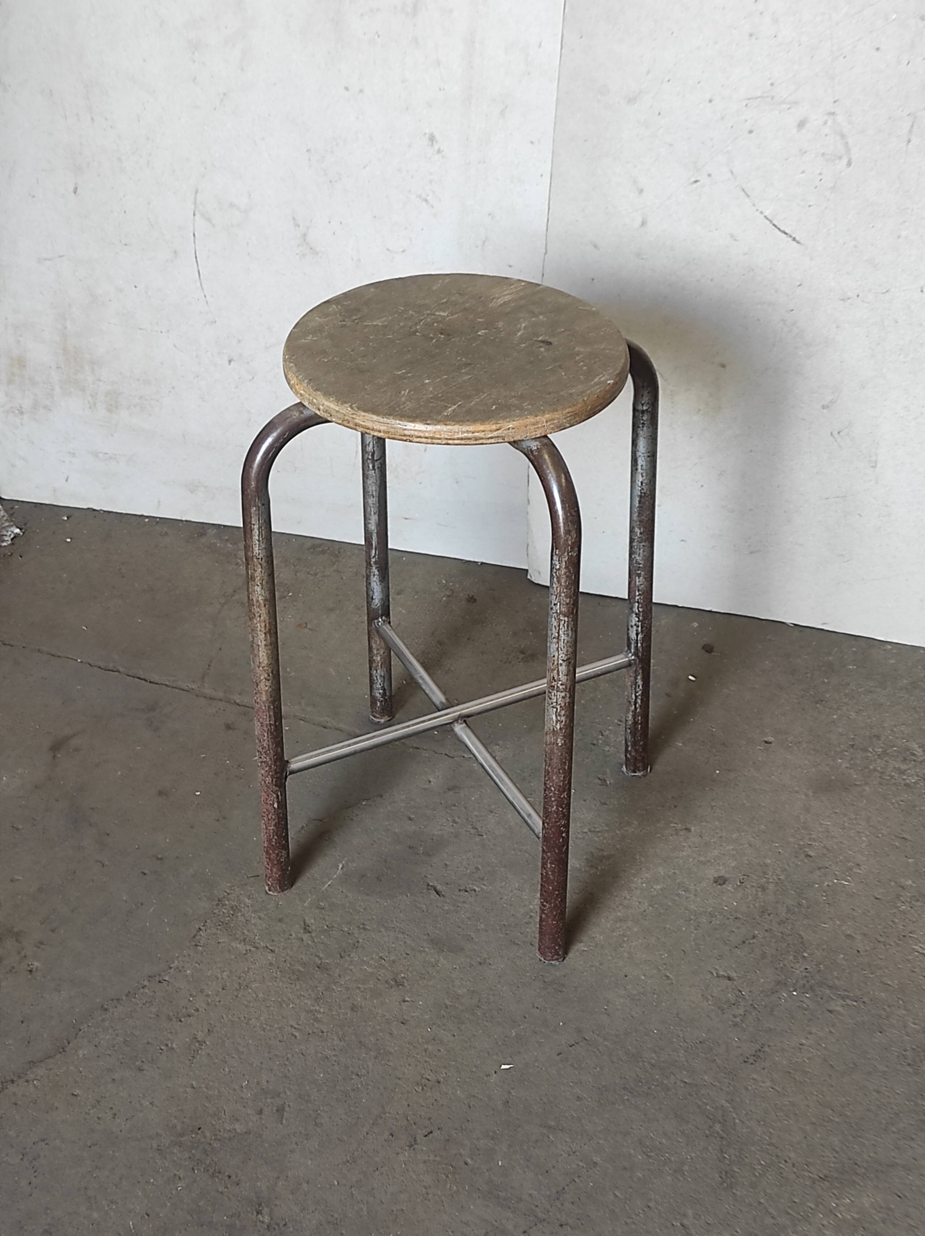 Old vintage metal and wood industrial workshop stool