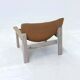 Stylish vintage armchair with saddle leather seat