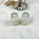 Vintage salt and pepper shakers and their chrome metal support