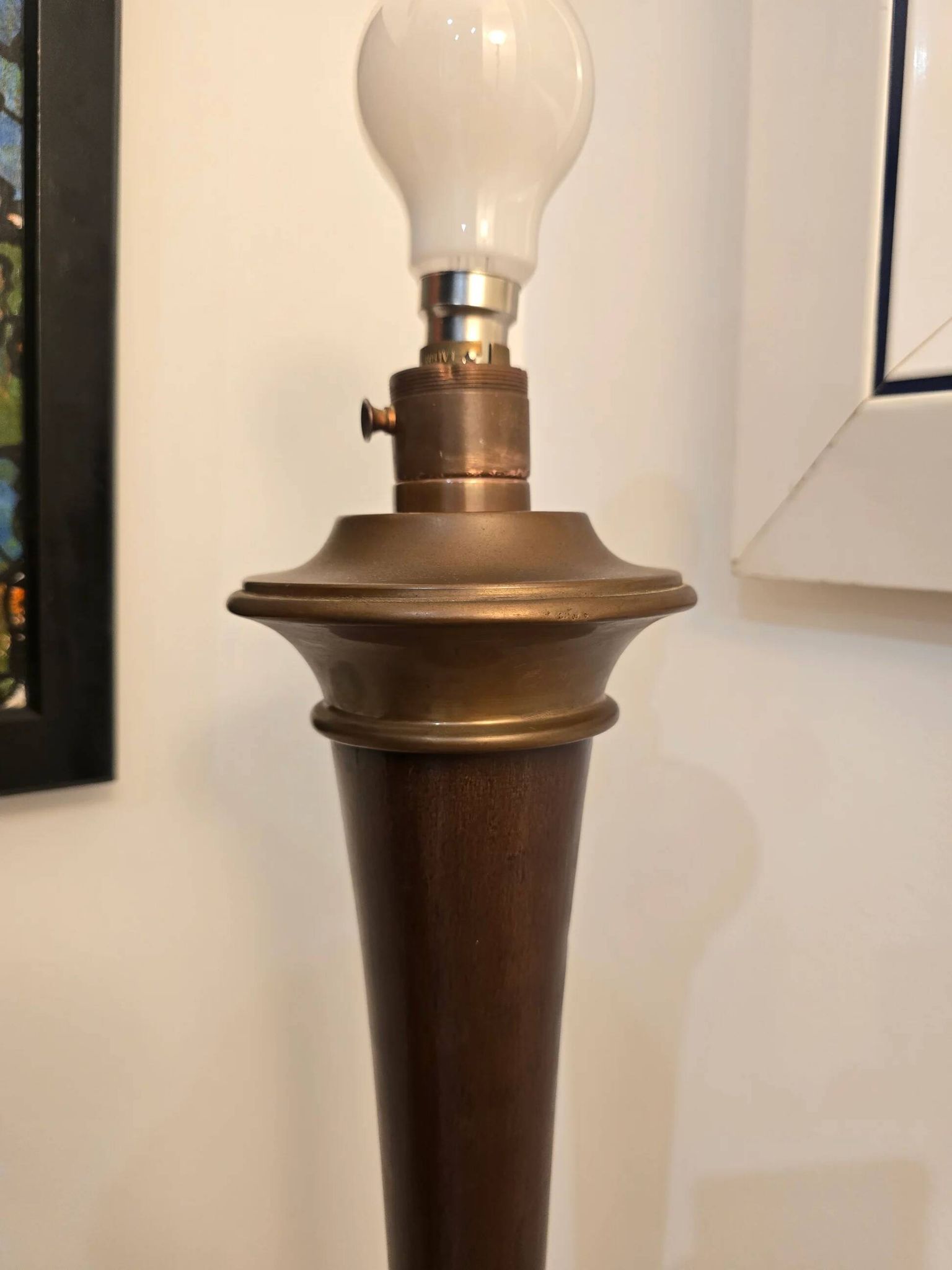 Vintage lamp base in Scandinavian style made of dark wood and bronze metal.