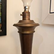 Vintage lamp base in Scandinavian style made of dark wood and bronze metal.