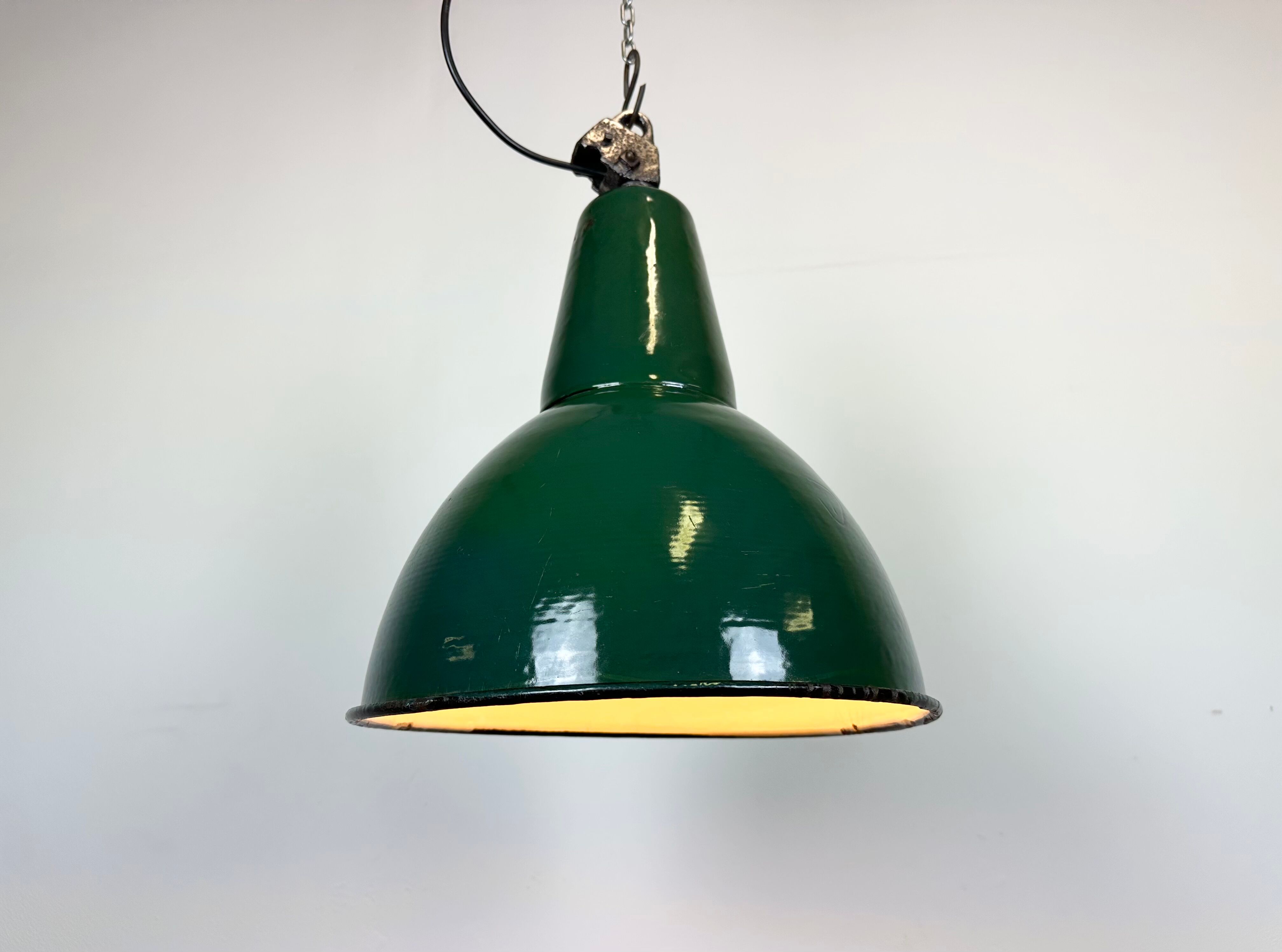 Industrial green enamel factory lamp with cast iron top, 1960s