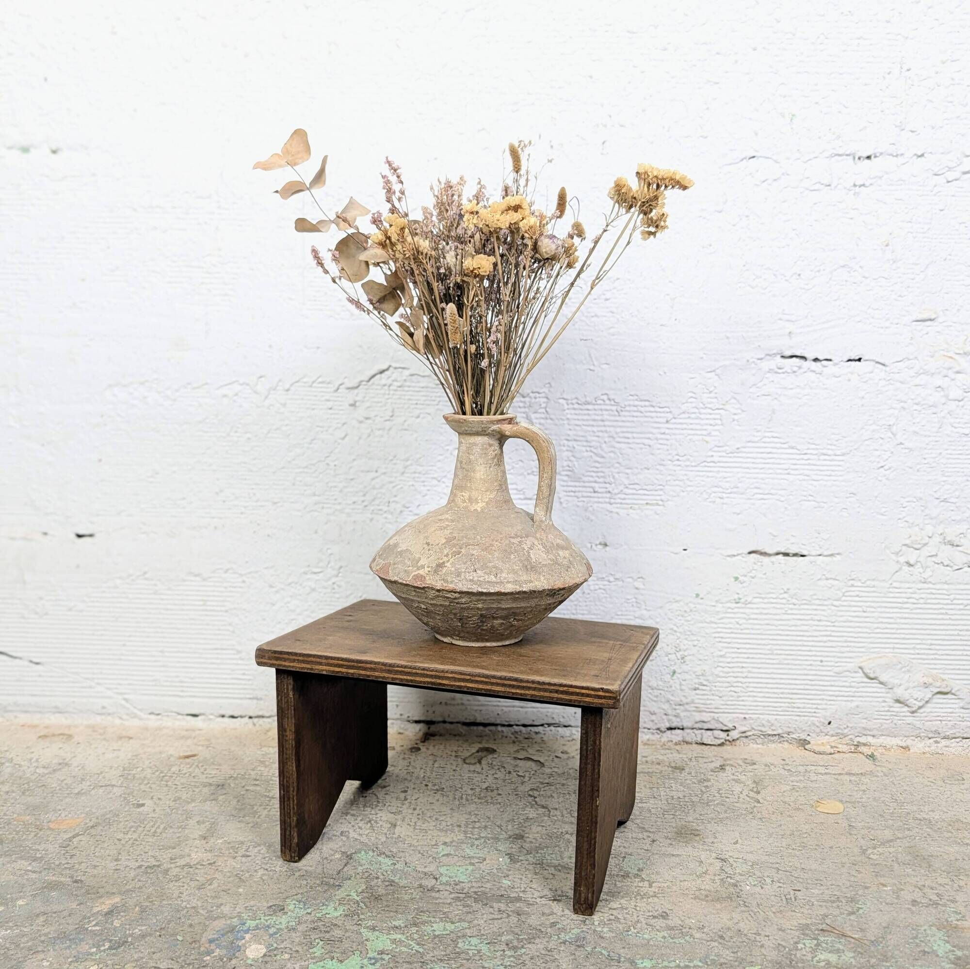 Small patinated wooden footrest bench