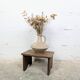Small patinated wooden footrest bench