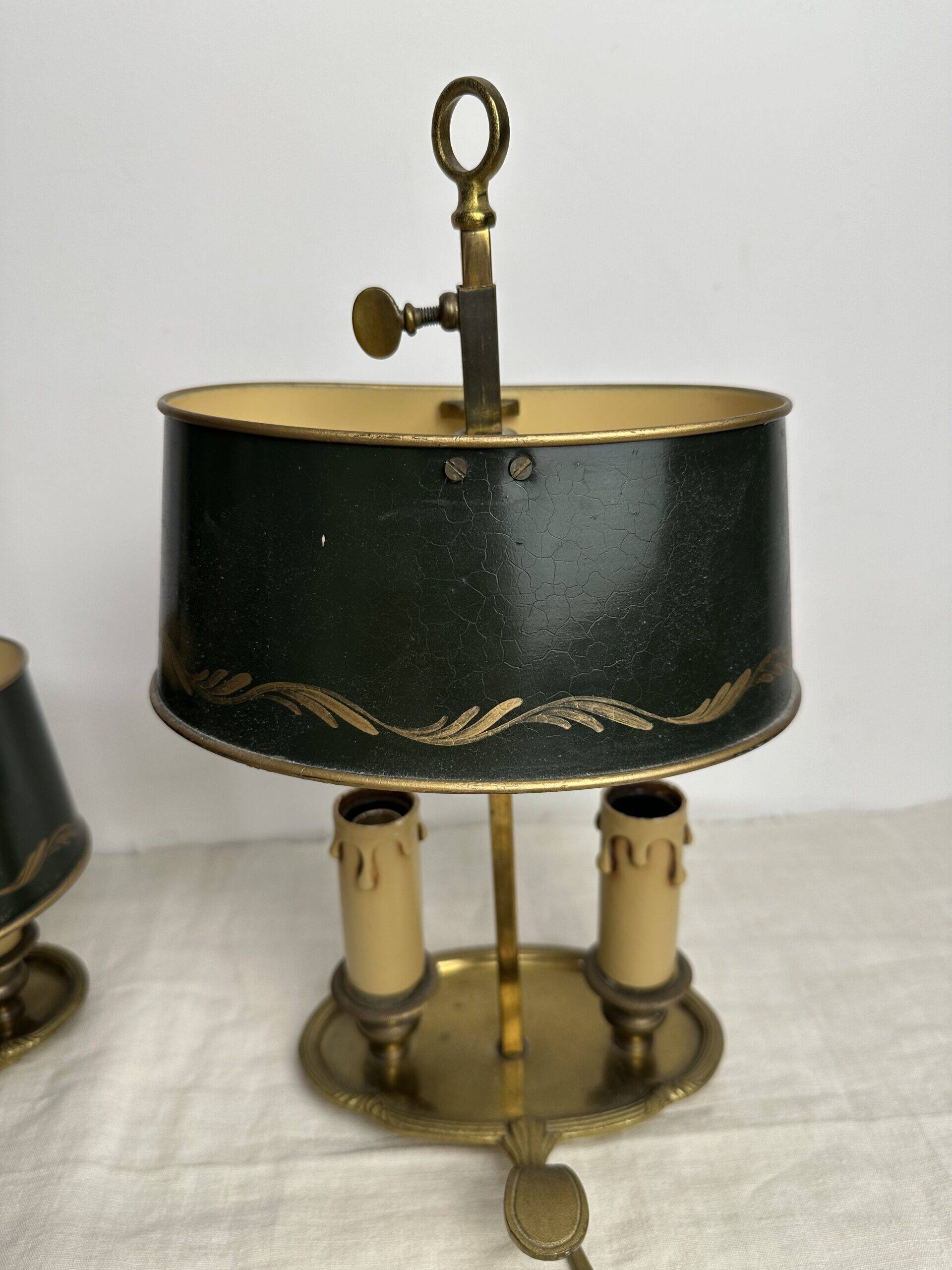 A pair of old brass bed warmers.