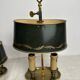 A pair of old brass bed warmers.